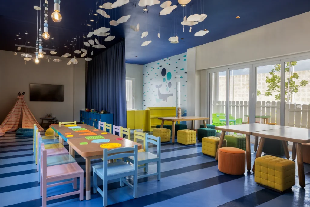 Colorful kids club playroom with tables and activities at Dreams Cap Cana Resort & Spa Explorer’s Club.