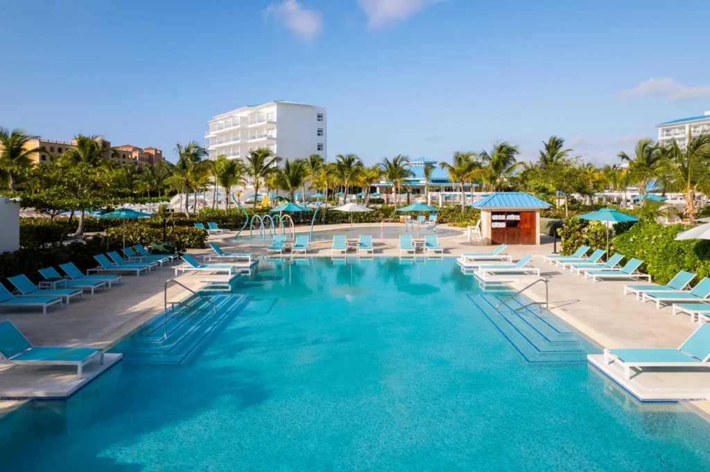 Family-friendly pool with lounge chairs and shallow areas at Dreams Cap Cana Resort & Spa.