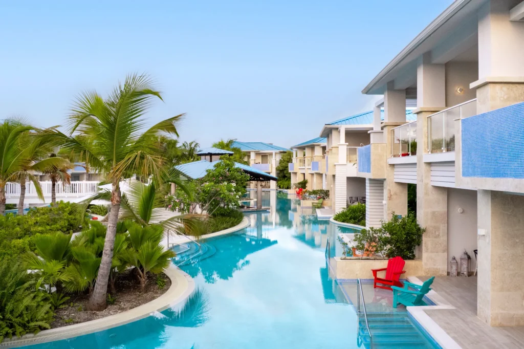 Swim-up pool with private terraces and lounge chairs at Dreams Cap Cana Resort & Spa.