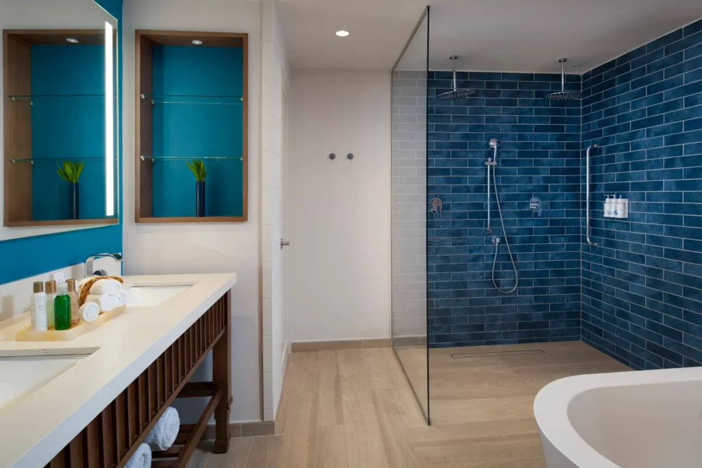 Preferred Club Junior Suite Ocean Front King bathroom with double vanity and walk-in rain shower at Dreams Cap Cana Resort & Spa.