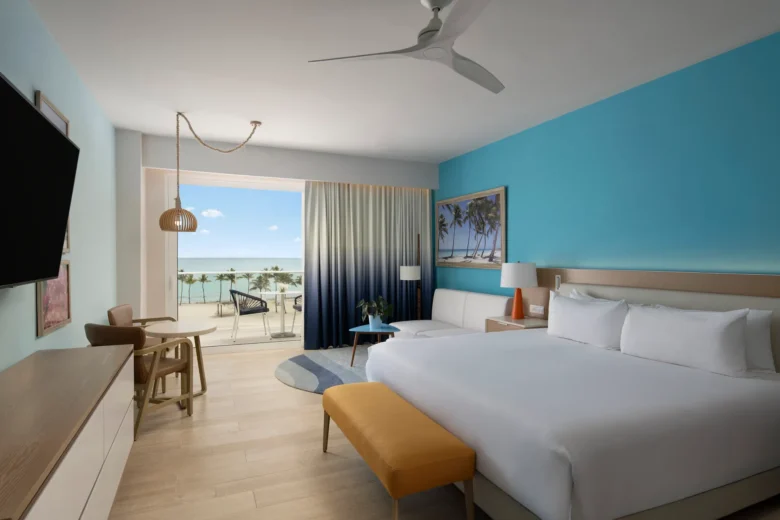 Preferred Club Junior Suite Swim Out King with king bed and terrace with direct pool access at Dreams Cap Cana Resort & Spa.
