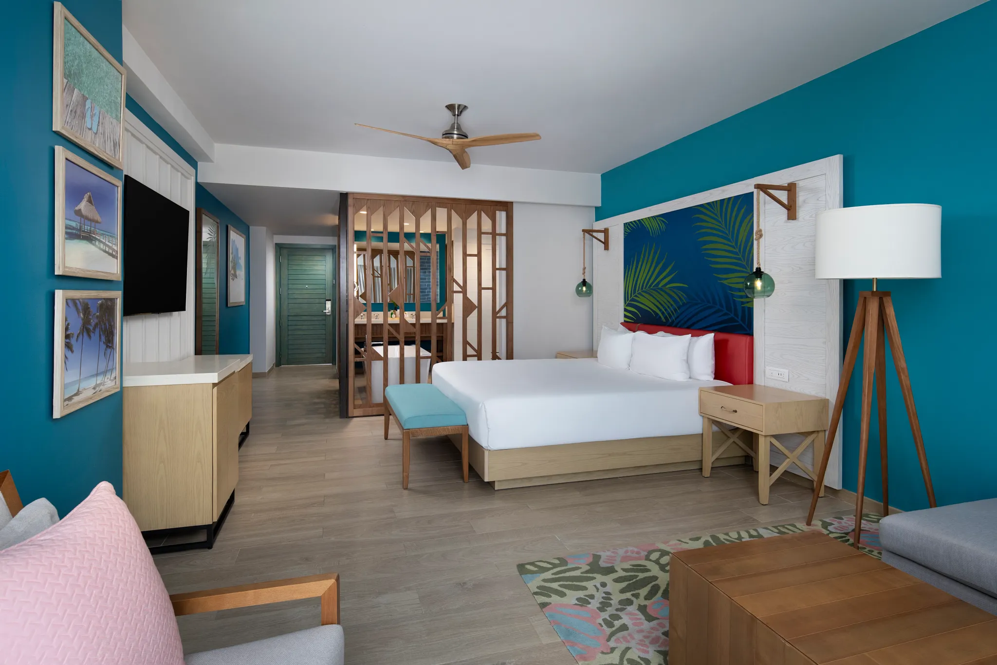 Preferred Club Presidential Suite with king bed and spacious living area at Dreams Cap Cana.