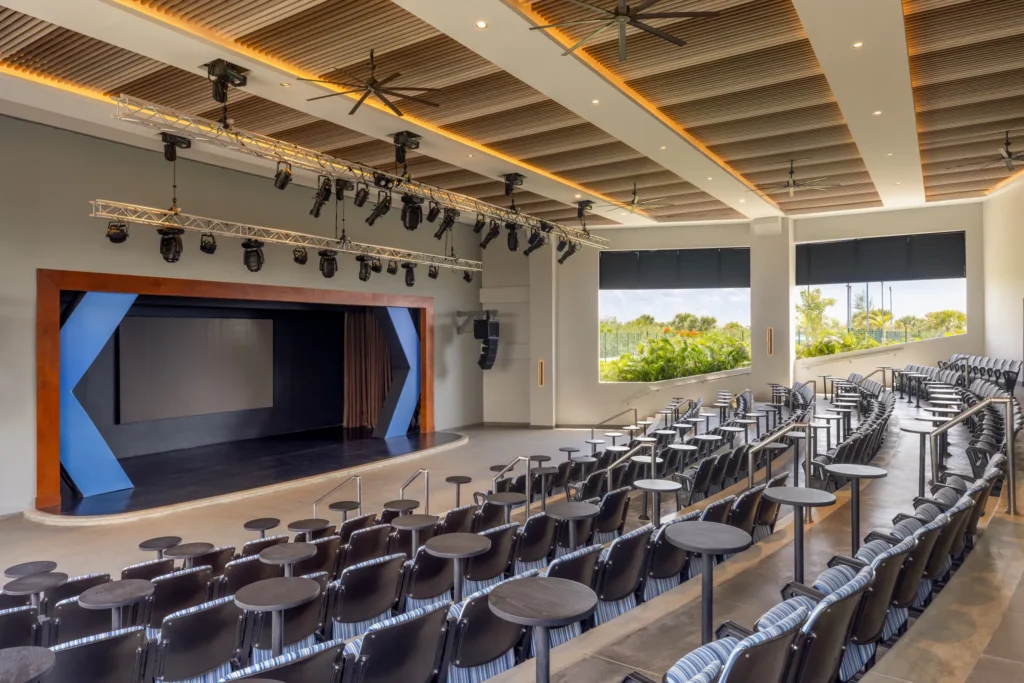 Indoor theater with stage and seating at Dreams Cap Cana Resort & Spa.