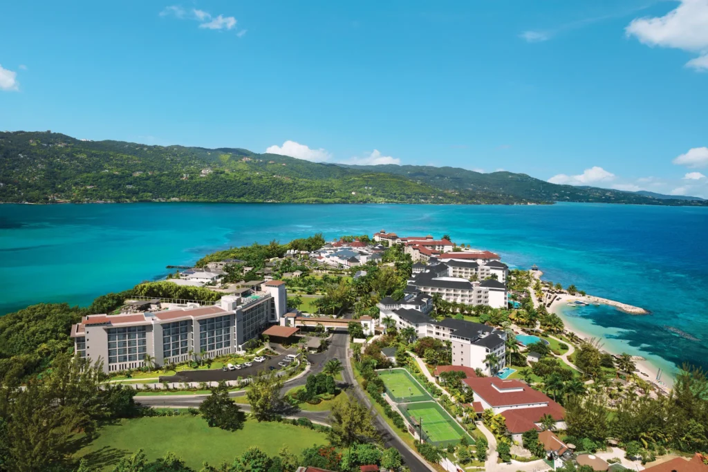 Aerial view of Breathless Montego Bay Resort with its signature skywalk bridge and lush tropical surroundings.