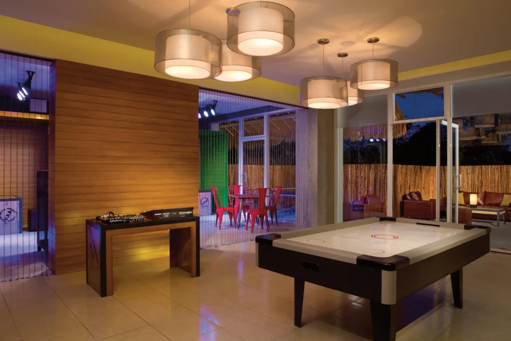Modern teen lounge with games and entertainment at Dreams Cozumel Cape Resort & Spa Core Zone.