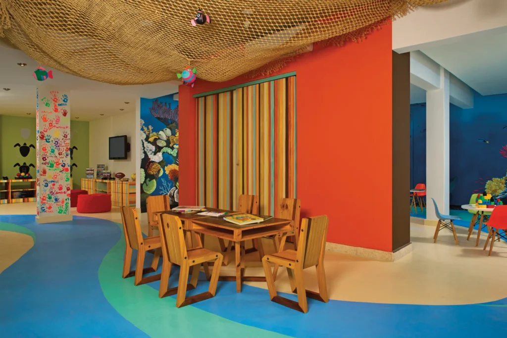 Bright children’s activity area with colorful décor at Dreams Cozumel Cape Resort & Spa.