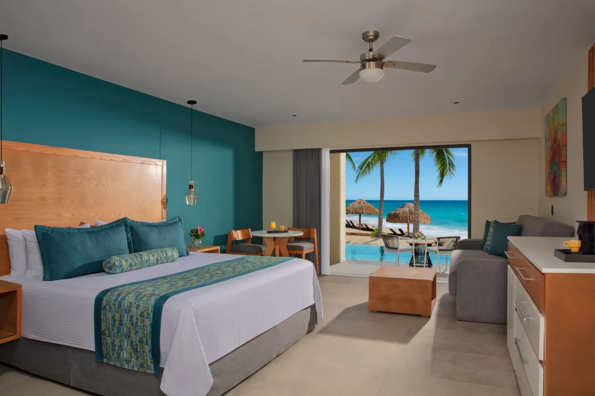 Preferred Club Junior Suite Swim Out Beach Front with king bed and ocean view at Dreams Cozumel Cape Resort & Spa.