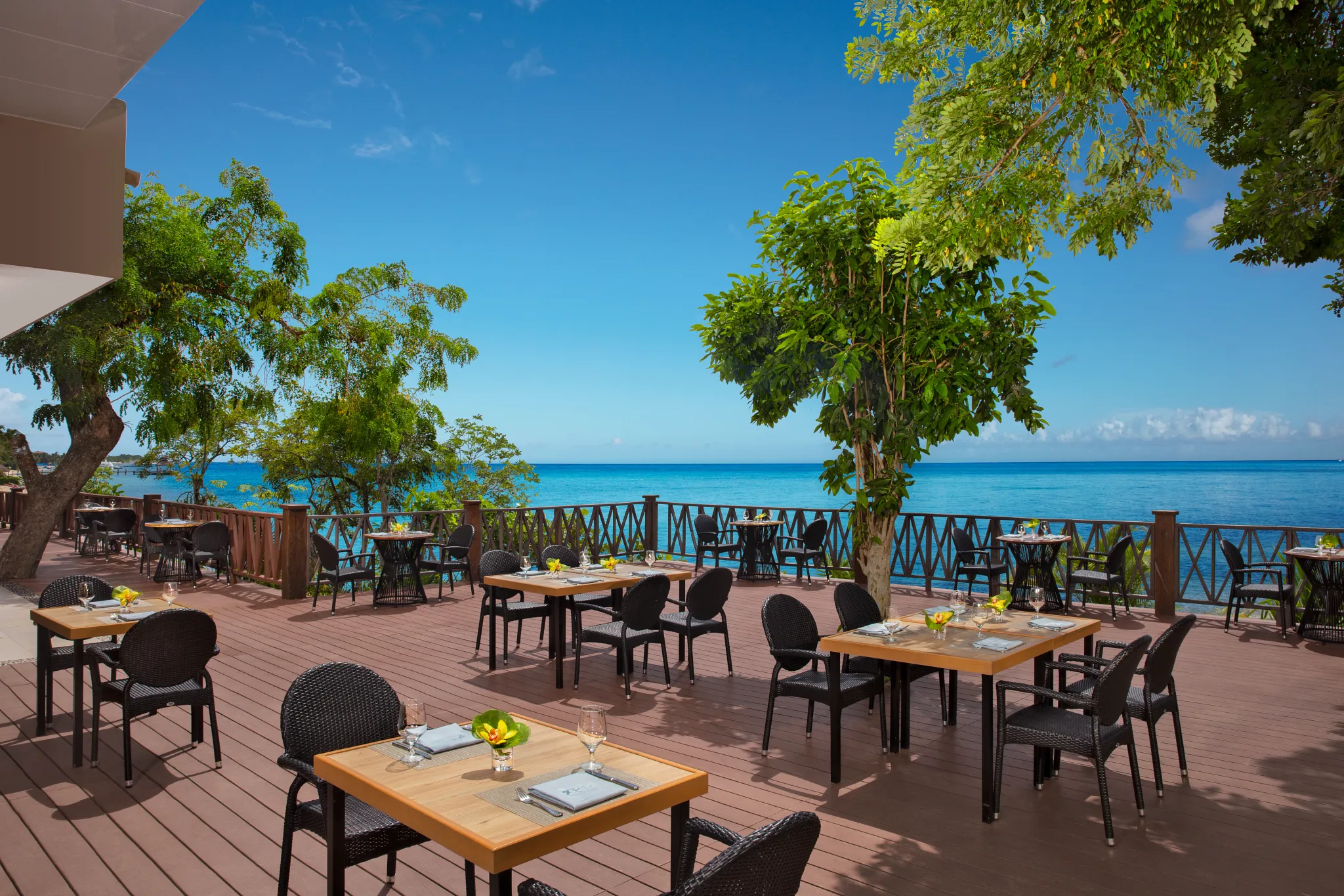 World Café at Dreams Cozumel Cape Resort & Spa featuring oceanfront terrace dining and international buffet selections.