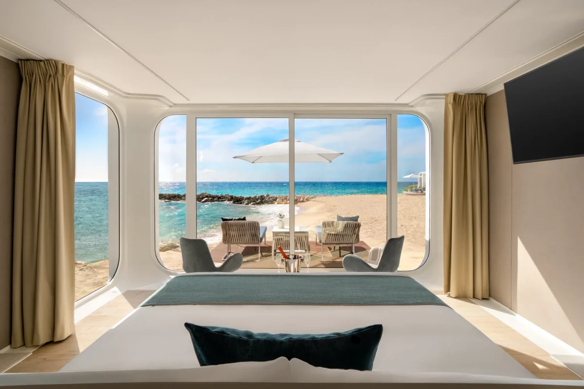 Preferred Club Mare Beachfront Bungalow bedroom with panoramic oceanfront view at Dreams Curaçao Resort