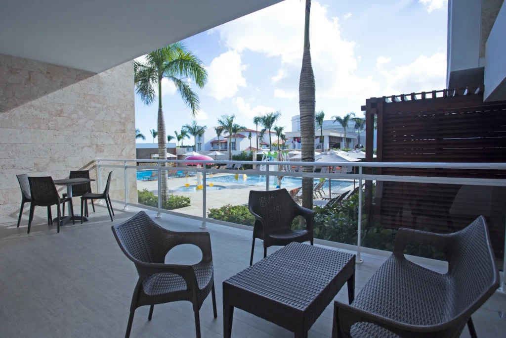 Preferred Club Family Suite Tropical View balcony overlooking the pool area at Dreams Dominicus La Romana.