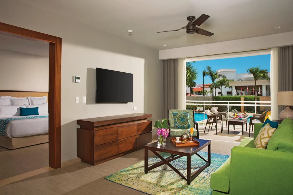 Preferred Club Two Bedroom Family Suite Tropical View living area with sofa bed at Dreams Dominicus La Romana.