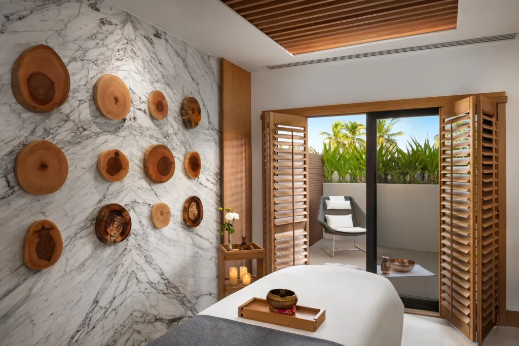 Private spa massage treatment room with marble wall décor at Dreams Estrella del Mar Mazatlan Golf & Spa Resort.