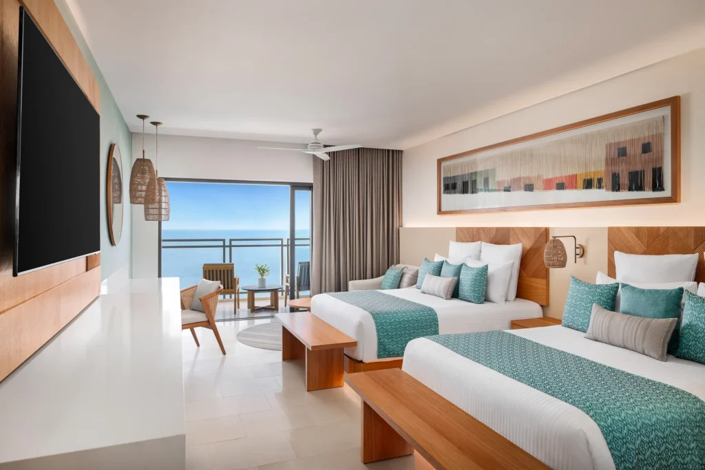 Junior Suite Ocean View with two double beds and private balcony at Dreams Estrella del Mar Mazatlan Golf & Spa Resort.