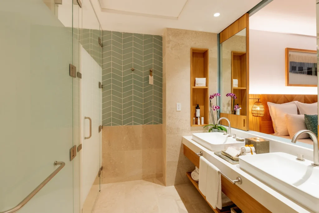 Junior Suite Ocean View bathroom with glass walk-in shower at Dreams Estrella del Mar Mazatlan.