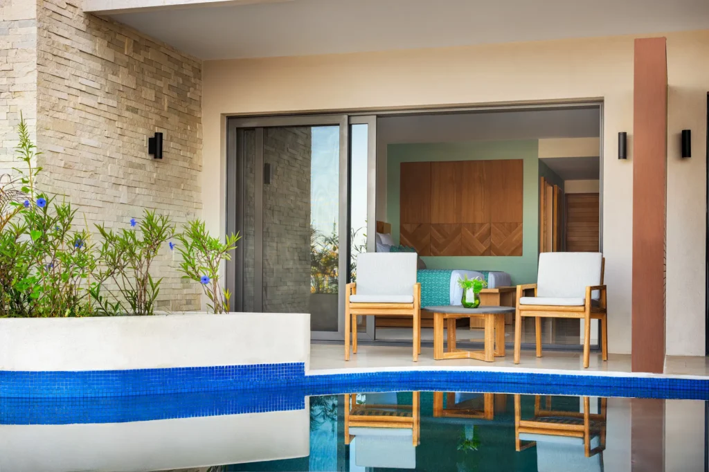 Junior Suite Swim Out private terrace with chairs and direct pool access at Dreams Estrella del Mar Mazatlan.