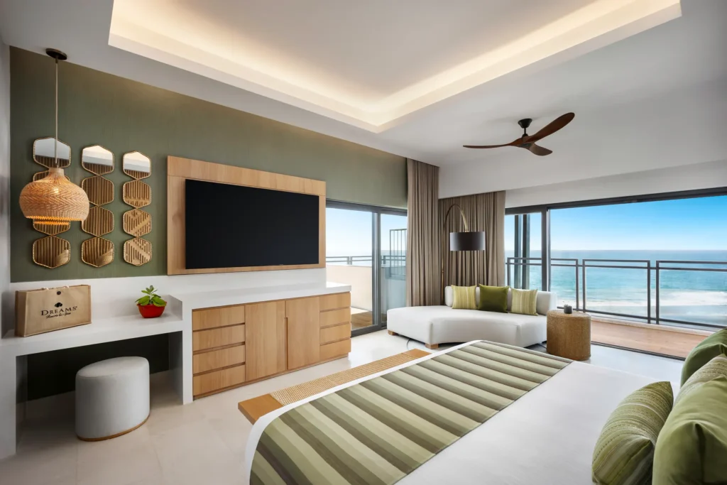 One-Bedroom Presidential Suite Ocean Front bedroom with ocean-view balcony at Dreams Estrella del Mar Mazatlan.