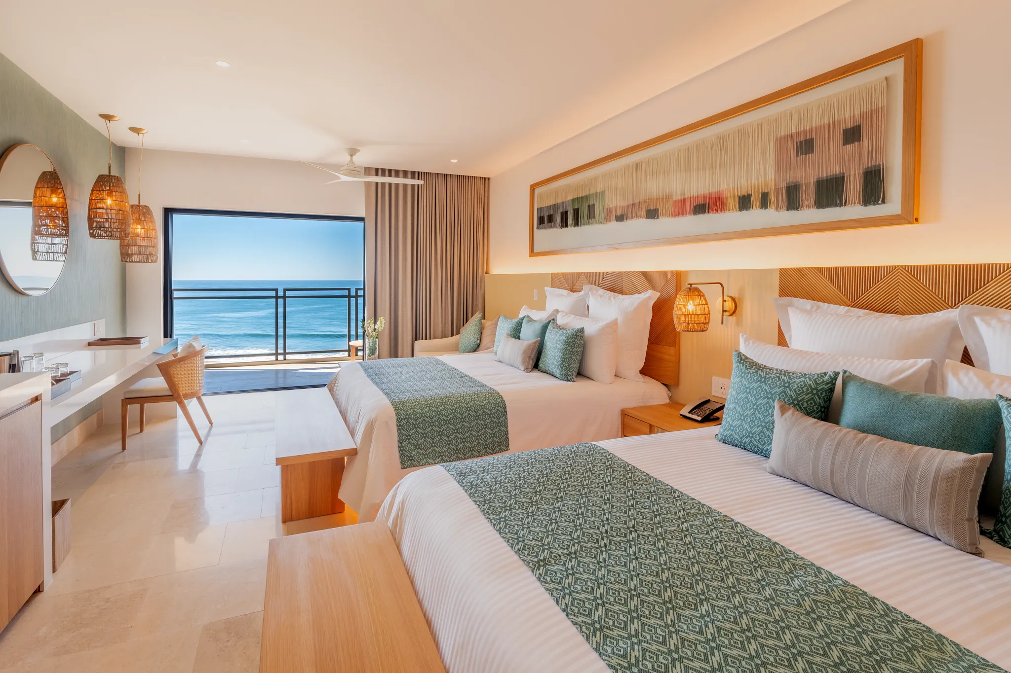 Preferred Club Junior Suite Ocean Front with two double beds and balcony overlooking the Pacific Ocean at Dreams Estrella del Mar Mazatlan.