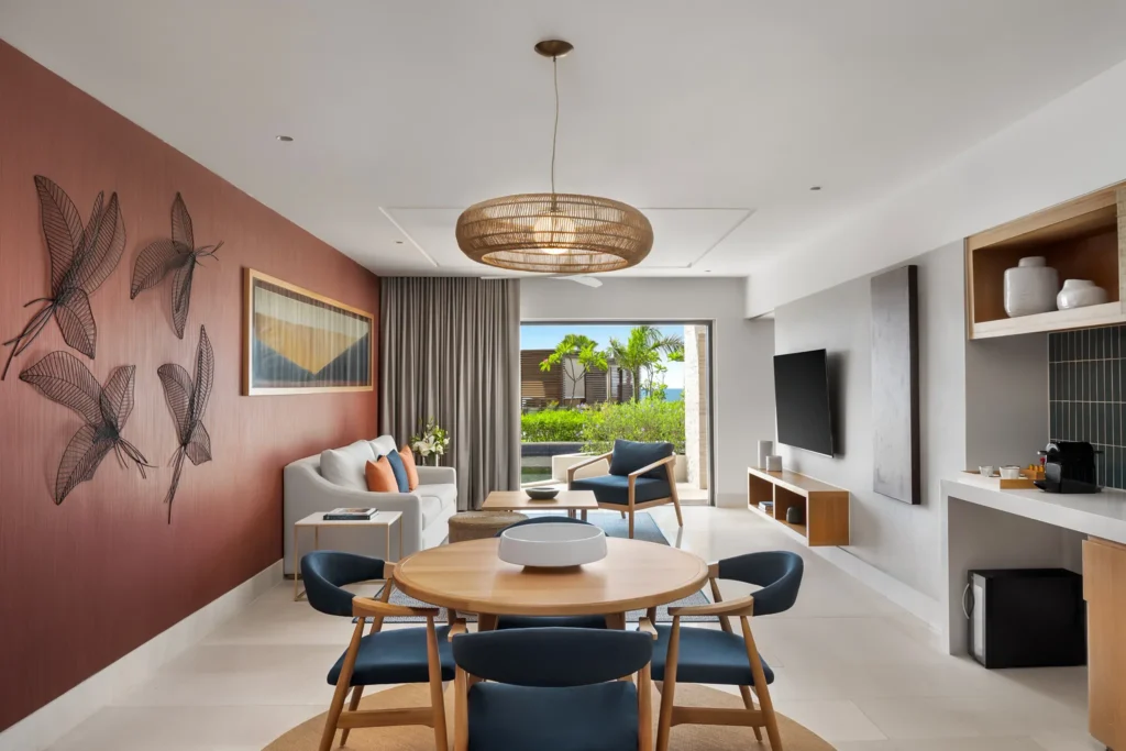 Preferred Club Premium Master Suite Swim Out living room with dining area at Dreams Estrella del Mar Mazatlan.
