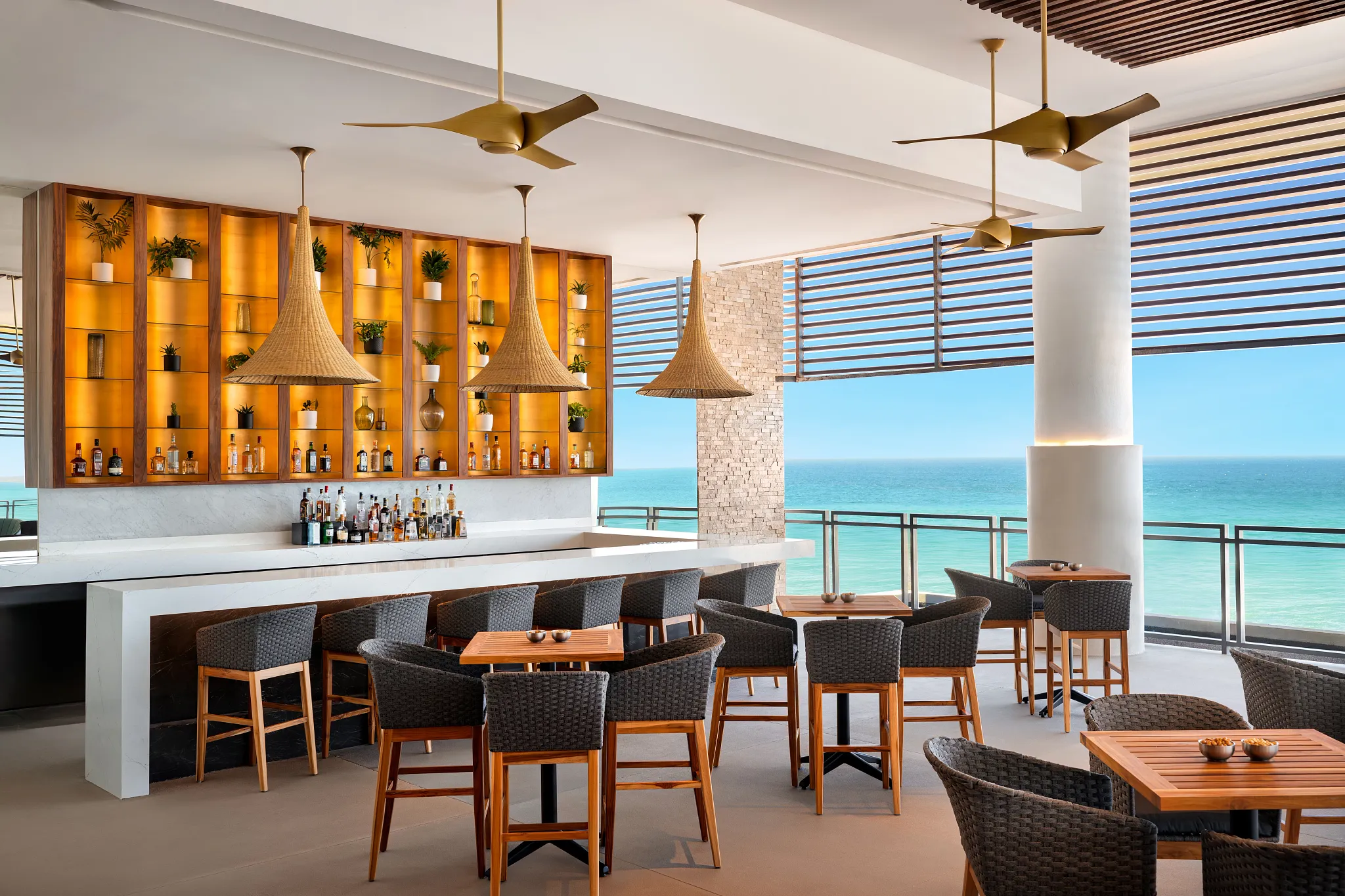 Rendezvous Lobby Bar at Dreams Estrella del Mar Mazatlan featuring an open-air bar with panoramic ocean views and modern lounge seating.