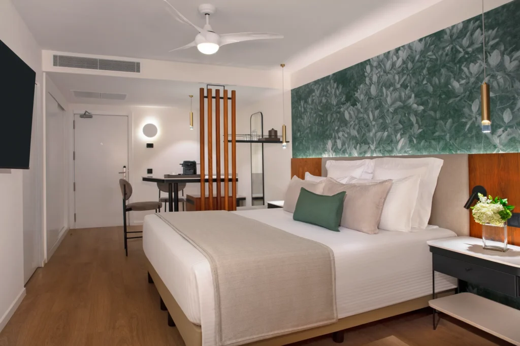 Deluxe Room with king bed and modern décor at Dreams Flora Resort & Spa Punta Cana.