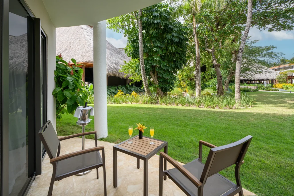 Preferred Club Junior Suite Family Room terrace with garden seating at Dreams Flora Resort & Spa.
