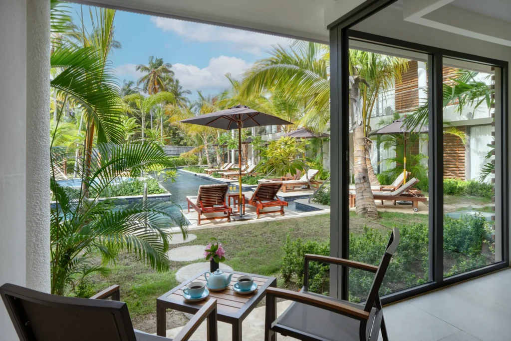 Preferred Club Junior Suite Swim Up terrace with direct pool access at Dreams Flora Resort & Spa.