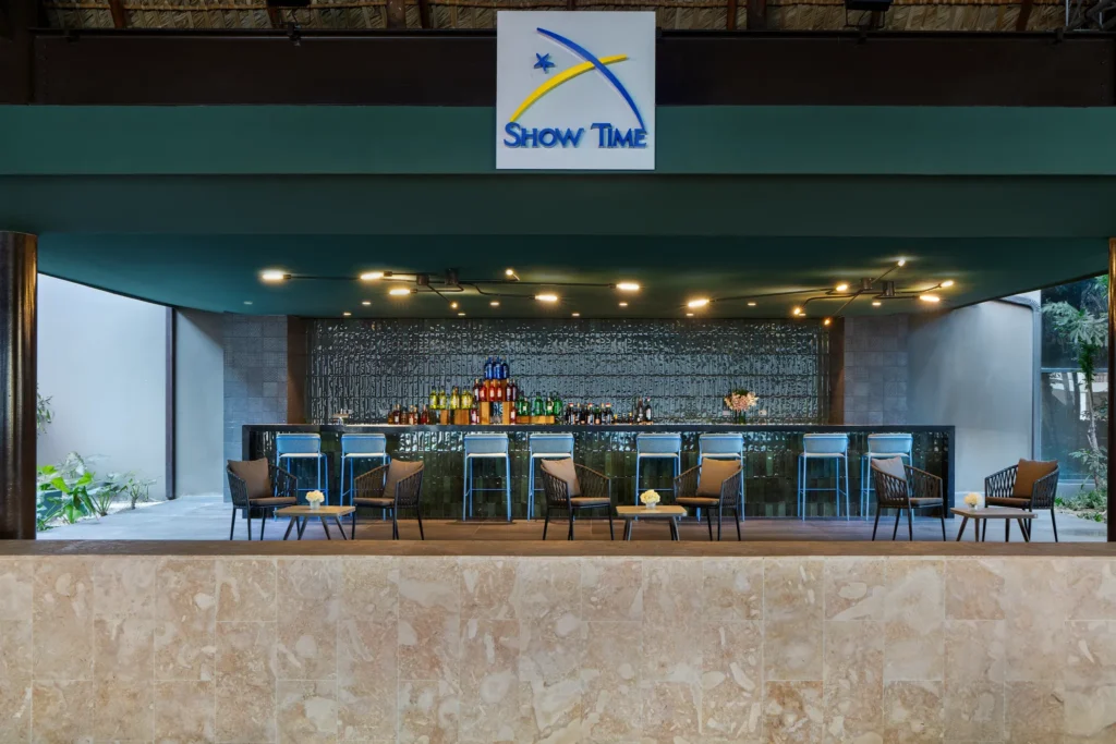 Showtime theatre bar at Dreams Flora Resort & Spa featuring a modern bar, lounge seating, and pre-show drinks atmosphere.