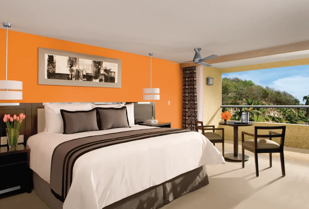 Deluxe Tropical View with Hot Tub room with king bed and private balcony at Dreams Huatulco Resort & Spa.