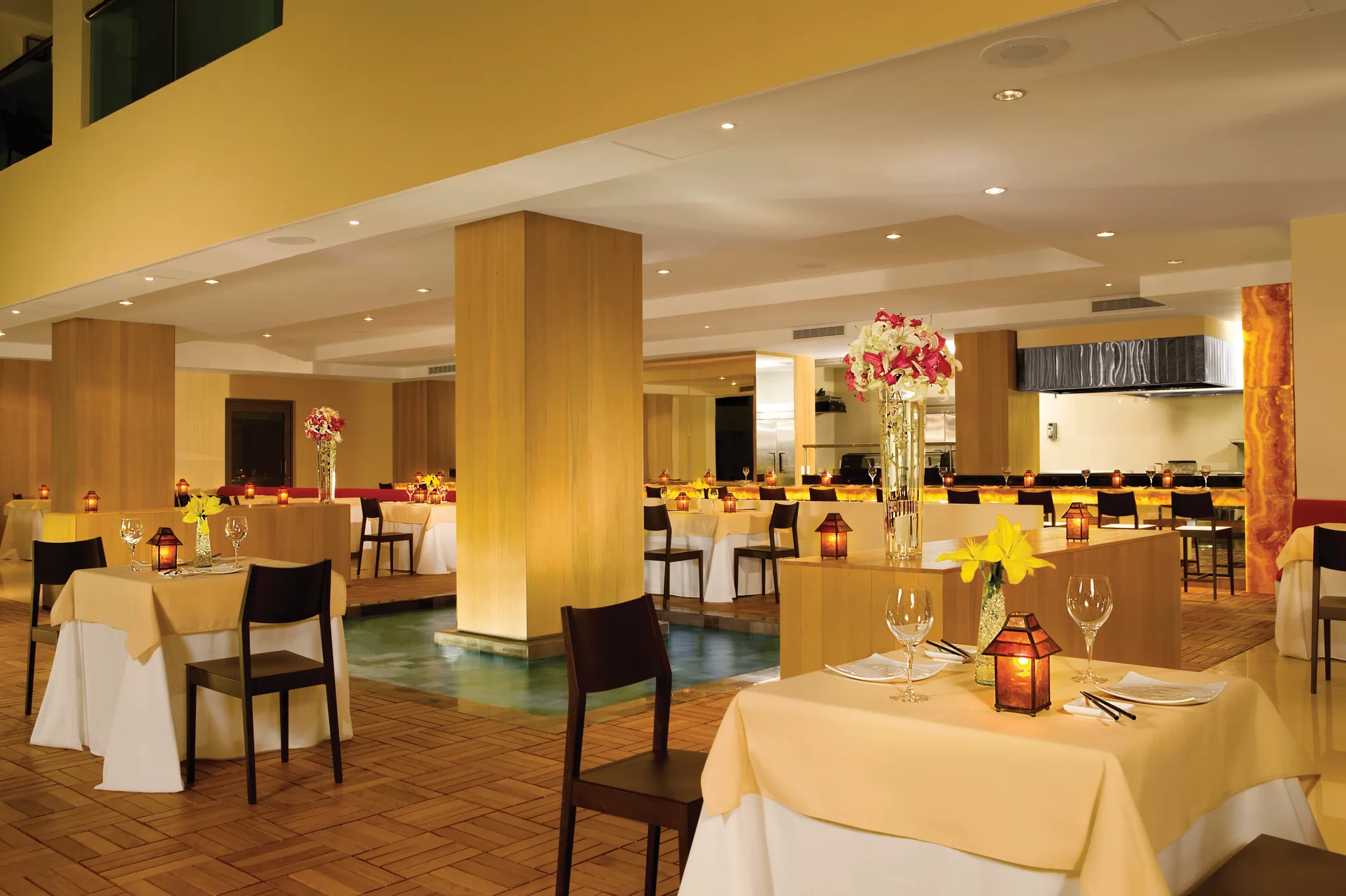 Himitsu Pan-Asian restaurant at Dreams Huatulco Resort & Spa featuring elegant indoor dining, serene water accents, and contemporary Asian-inspired décor.