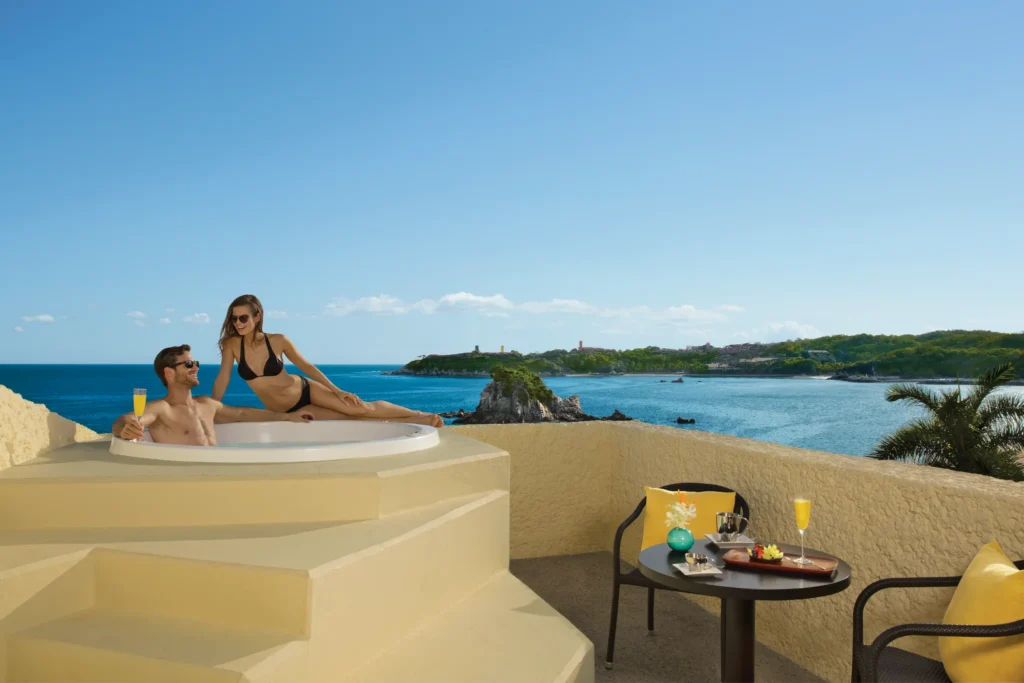 Private oceanfront terrace with hot tub at Preferred Club Junior Suite at Dreams Huatulco Resort & Spa.