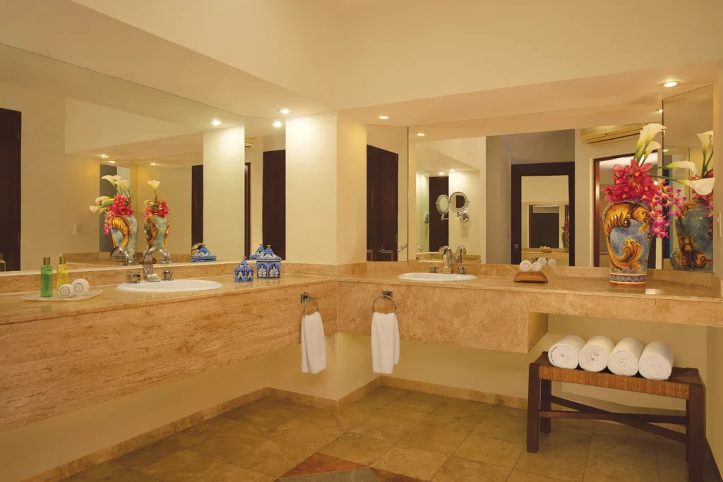 Preferred Club Presidential Suite bathroom with double vanity and elegant finishes at Dreams Huatulco Resort & Spa.