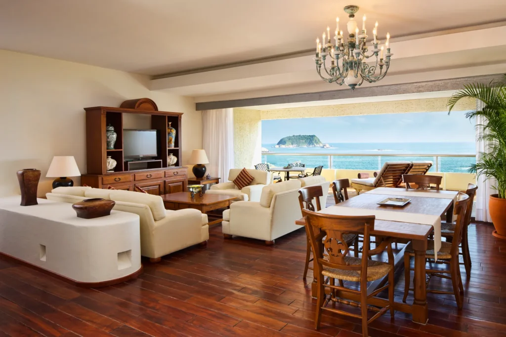 Preferred Club Presidential Suite living and dining area with oceanfront terrace at Dreams Huatulco Resort & Spa.