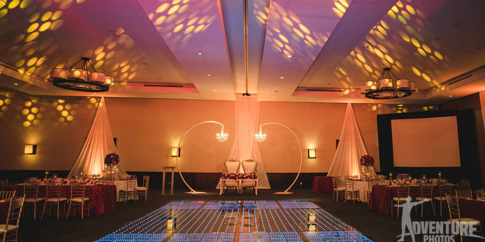 Ballroom wedding reception setup with LED dance floor at Dreams Jade Riviera Cancun