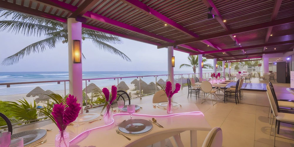 Carnival Terrace oceanfront reception setup with modern décor at Dreams Jade Riviera Cancun