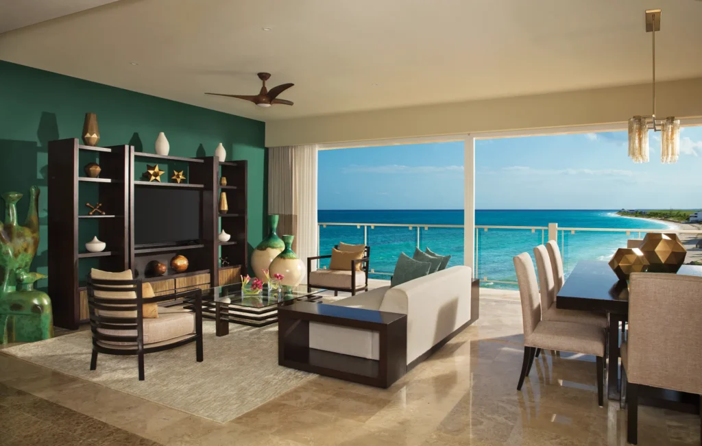 Preferred Club Governor Suite living and dining area with ocean view at Dreams Jade Resort & Spa.
