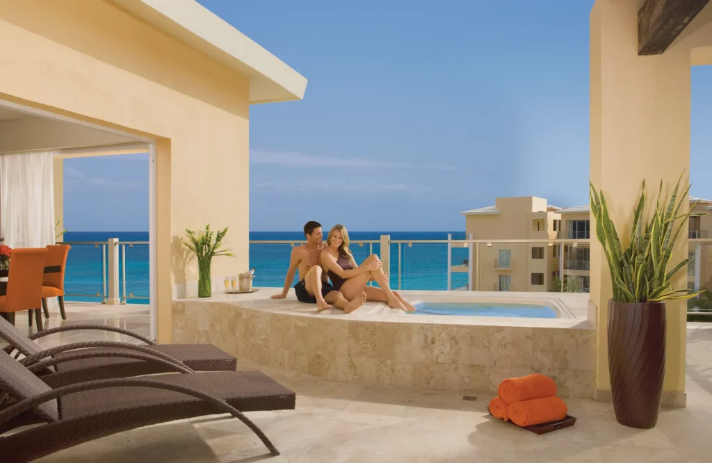 Preferred Club Governor Suite private terrace with outdoor hot tub overlooking the ocean at Dreams Jade Resort & Spa.