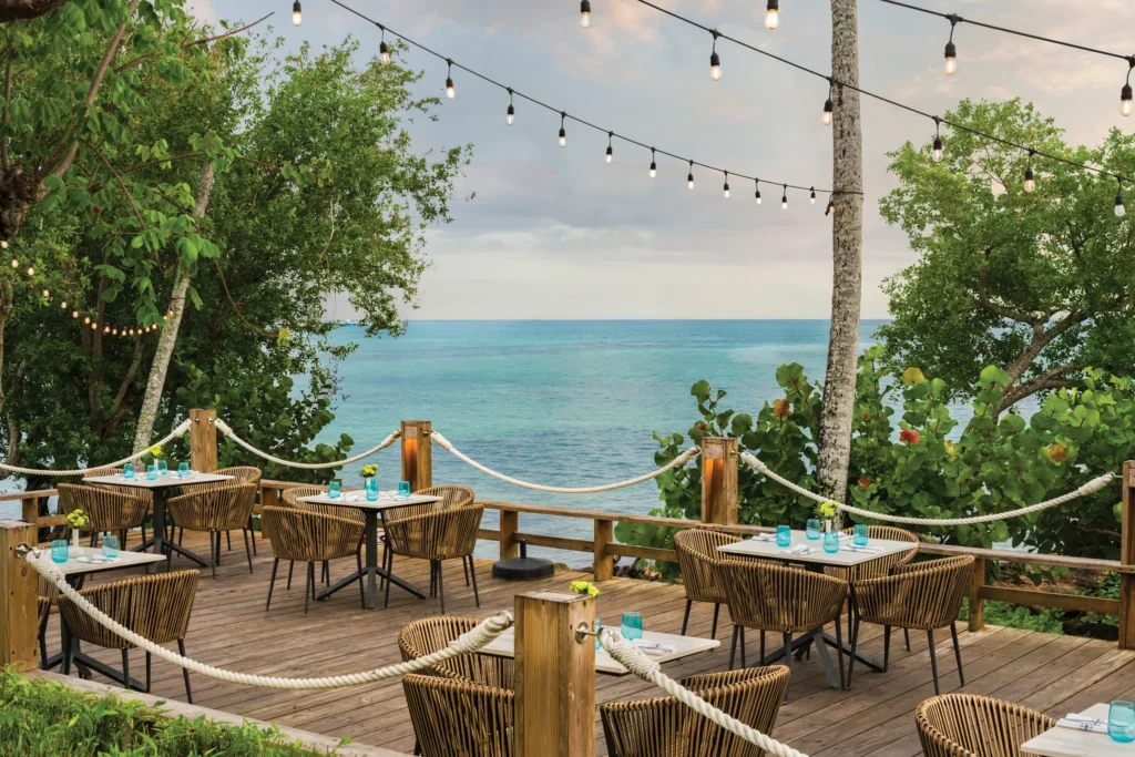 Coastal Grill restaurant at Dreams La Romana Resort & Spa featuring open-air dining, grilled specialties, and an elegant Caribbean-inspired atmosphere.