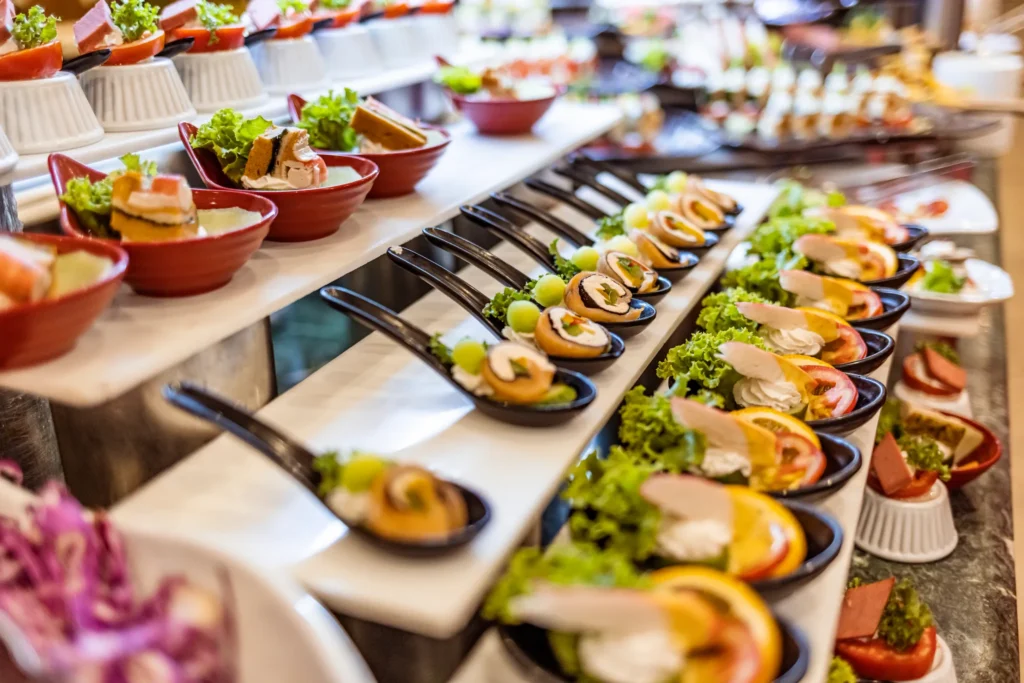Spices Market restaurant at Dreams La Romana Resort & Spa featuring international buffet stations, modern décor, and a vibrant dining atmosphere.