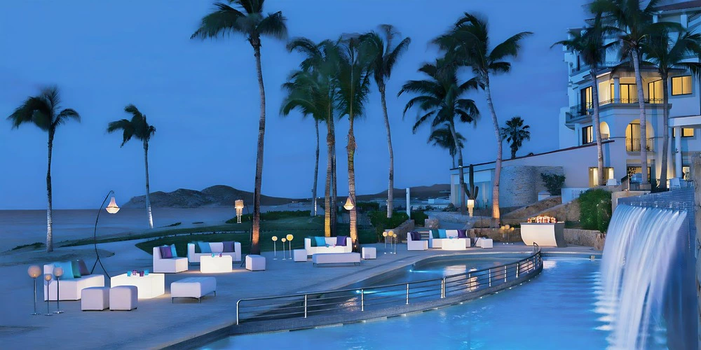 Cascada Pool Terrace evening event setup with ocean views at Dreams Los Cabos