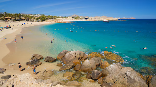 Chileno Bay beach with clear turquoise water and snorkeling near Dreams Los Cabos Suites Golf Resort & Spa