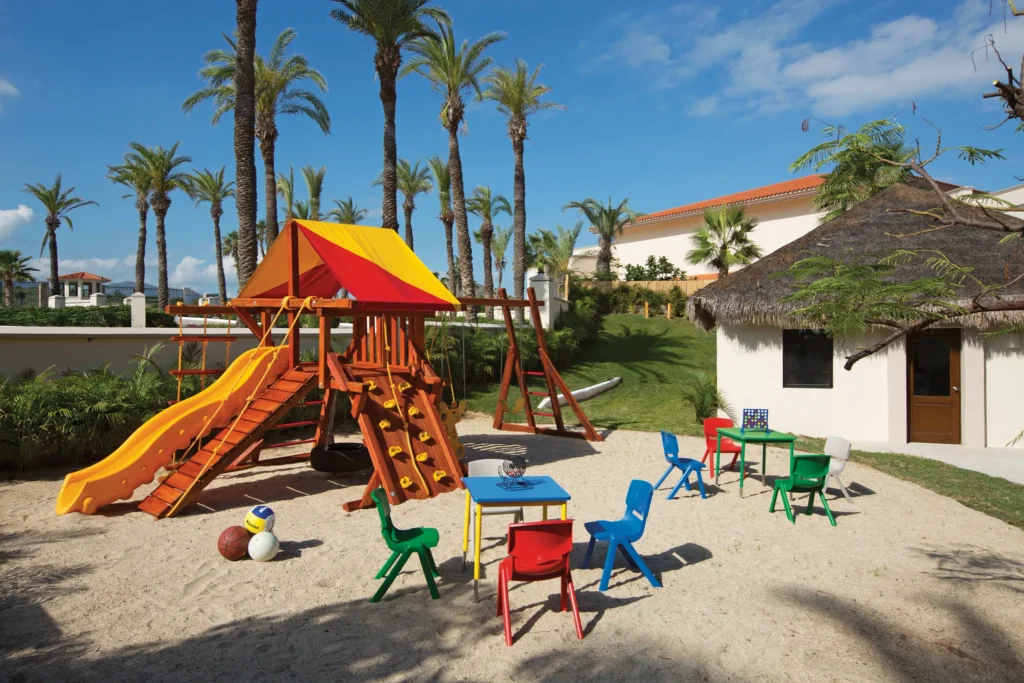 Outdoor playground and play area at the Explorer’s Club for Kids at Dreams Los Cabos Suites Golf Resort & Spa.