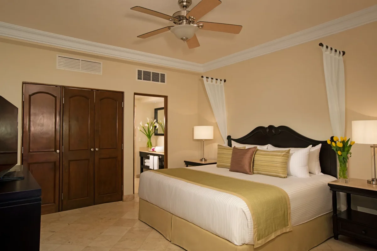 Family Junior Suite Ocean View private king bedroom at Dreams Los Cabos Suites Golf Resort & Spa.