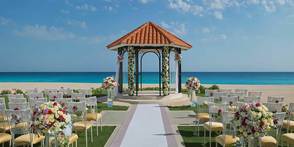 Beachfront wedding gazebo ceremony setup at Dreams Los Cabos with ocean views
