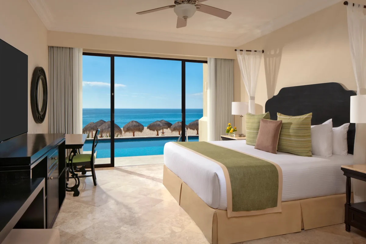 Oceanfront king bedroom with terrace swim-out pool and Sea of Cortez view in the Preferred Club Presidential Suite Oceanfront Swim Out at Dreams Los Cabos.