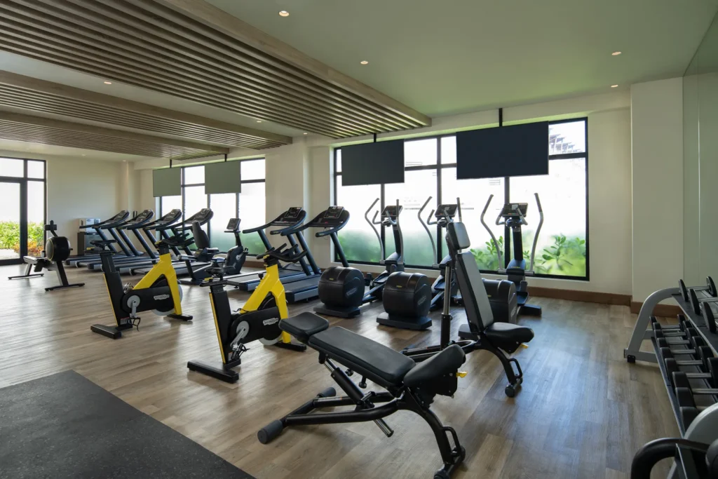 Modern fitness center with cardio and strength equipment at Dreams Macao Beach Punta Cana Resort.