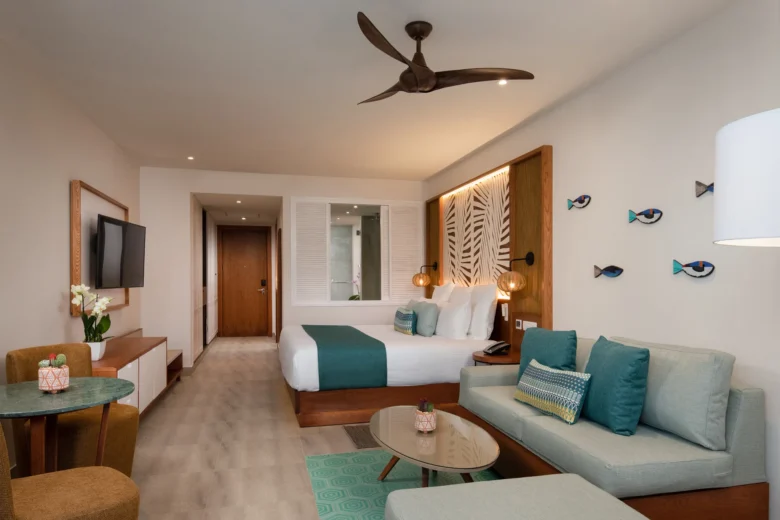 Preferred Club Junior Suite Swim Out with king bed and living area at Dreams Macao Beach Punta Cana.