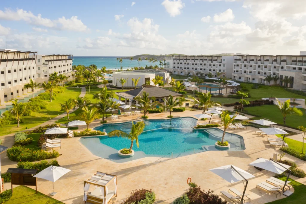 Relaxation pool surrounded by tropical landscaping and ocean views at Dreams Macao Beach Punta Cana.