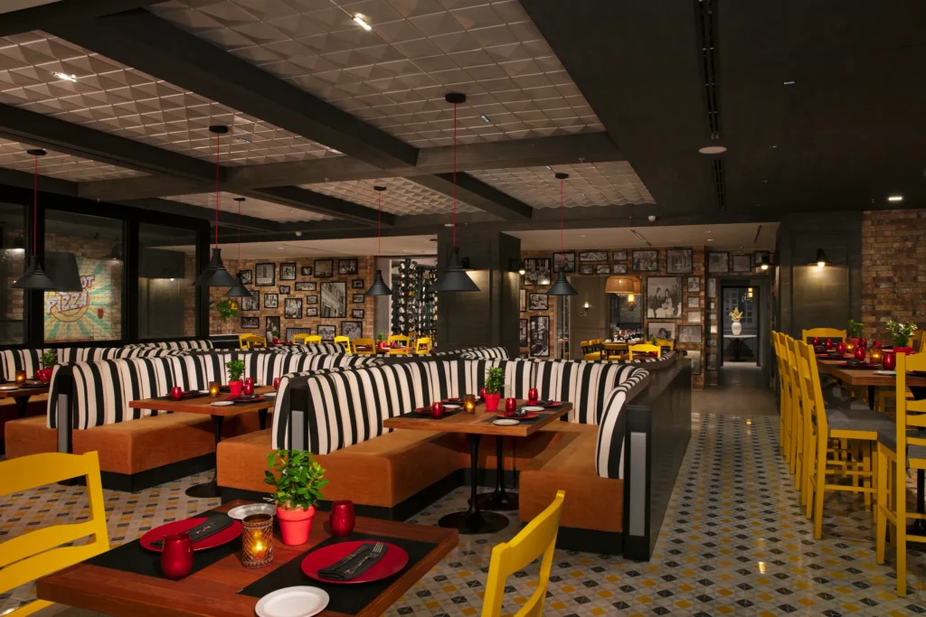 Portofino Italian restaurant at Dreams Natura Resort & Spa featuring elegant dining, authentic Italian dishes, and a warm, inviting ambiance.