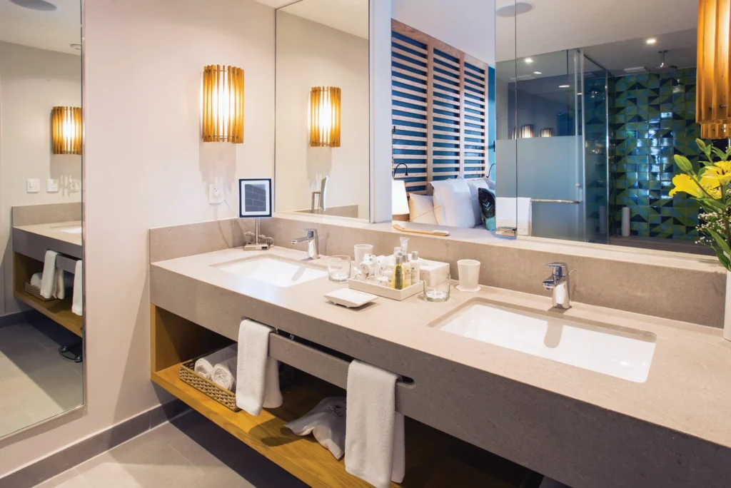 Preferred Club Governor Suite bathroom with double vanity and modern design at Dreams Natura Resort & Spa.