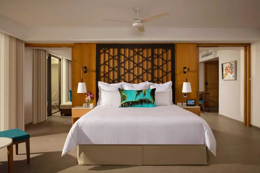 Preferred Club Governor Suite king bedroom with modern décor at Dreams Natura Resort & Spa.